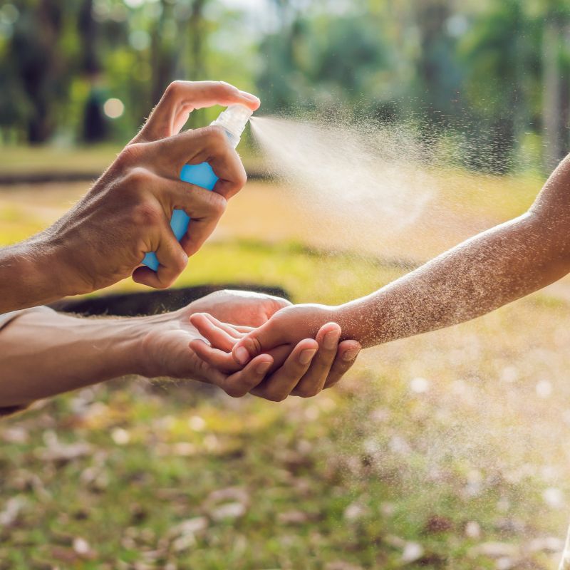 Spraying repellent | Healthy Travel in Costa Rica